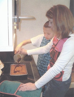 My Rach, cooking with me when I was about 13 (from Josh's photos)