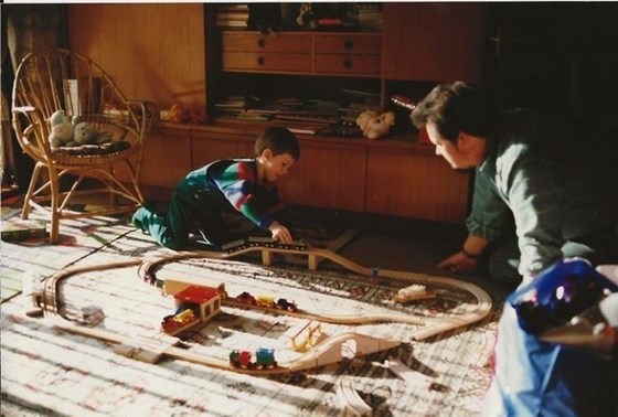 John’s eldest, Spencer, with his favourite train set as a child. John loves spoiling his boys. 