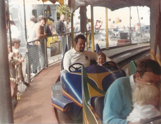 All the fun of the fair. John enjoying a ride with eldest son, Spencer 