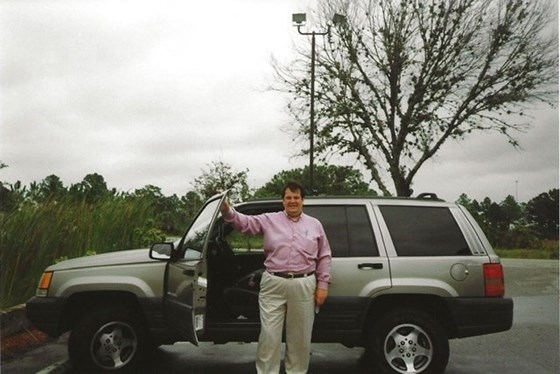 Hop in! John poses for a photo as he shows off the “ride” for USA family trip 1 in 1998, Florida