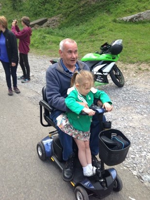 Chloe with Grandpa on his scooter... Beep Beep! 