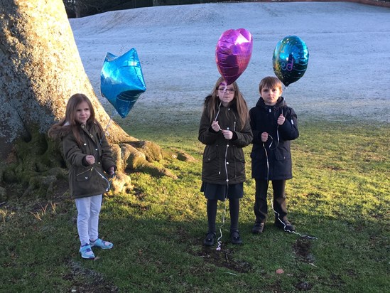 David’s grandchildren letting off balloons in memory  