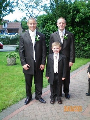 me and my dad and nephew on my wedding day