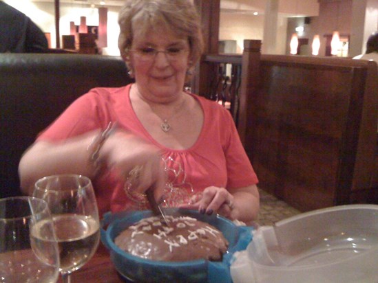Mum cutting her birthday cake.  70th I think