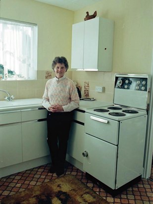 Joyce proudly showing off her new kitchen in 1996