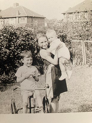 Cousins Chris, being held by lifelong family friend Margaret, and Derek in our Grandparents garden 1947.