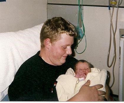 Daniel holding he's little girl for the 1st time 23/11/2004