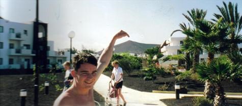 Aidan in Lanzarote- he is pointing to the top of the hill he ran up & left a little something....