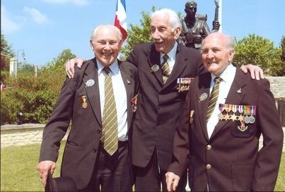 Three D-Day veterans. Between Captain John Milton and Jim Brown at Crepon 2006
