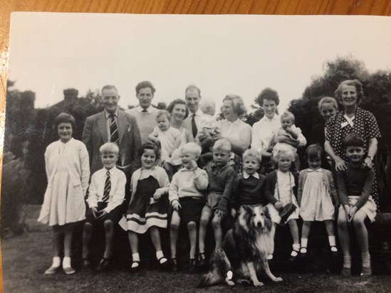 The Savill family - Norman and Pat holding Nancy, Mark sitting to dog's right.