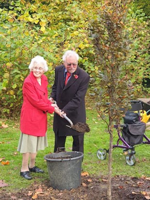 Sandra and Mike planting the tree