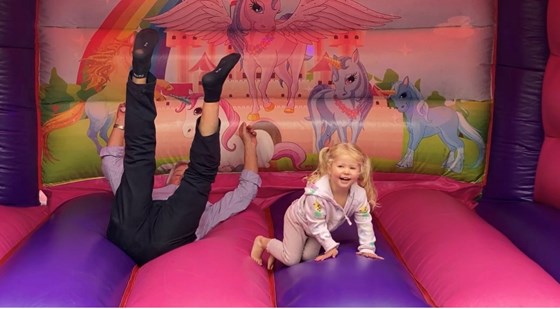 Chris & Luna on bouncy castle