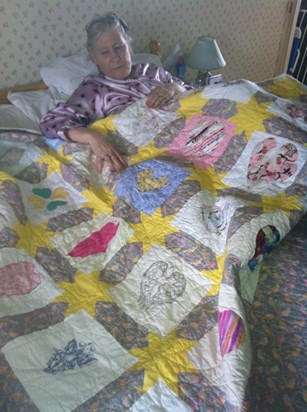 Glenys with the Healing Heart quilt our online group CRAFT made for her.