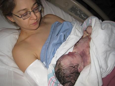 Naomi holds Ocean Star minutes after her birth.