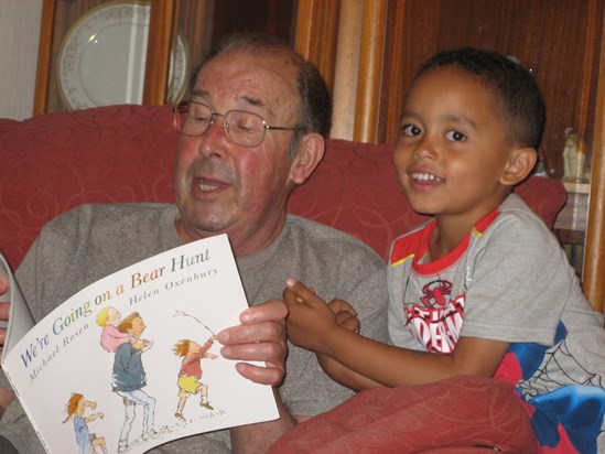 Grandad reading to Kundi