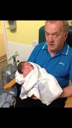 Holding his great niece just 20 minutes old 