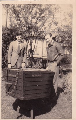 Bill with his school friend Frank & the boat they built.