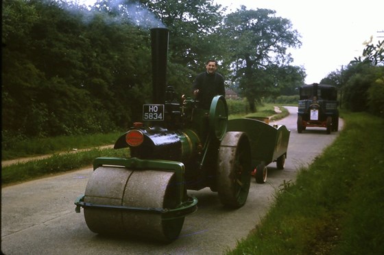 Bill driving a steam roller, July 1965