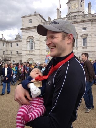 Cuddles after running the London Marathon for Shooting Stars