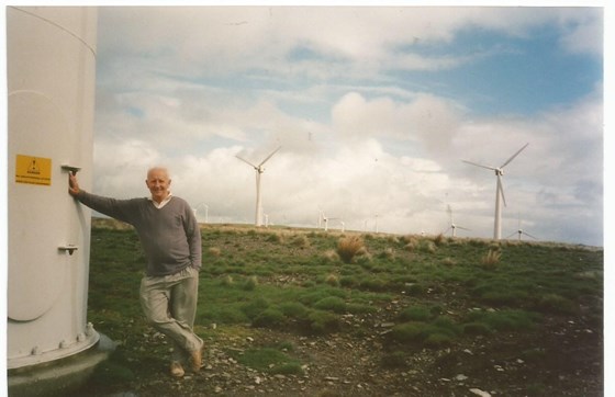 John up close to a wind turbine