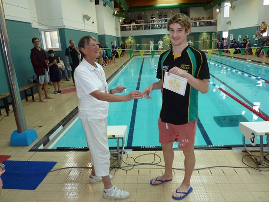 Julia Presenting Mark Edmundson the Wiltshire Boy Swimmer of the year award, December 2017 at the Corsham Open meet