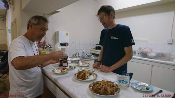 Simon volunteering at repair cafe Redditch. Boon yeng trying out the best cake in the world.