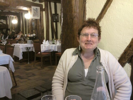 Leonie happy at a Rouen restaurant