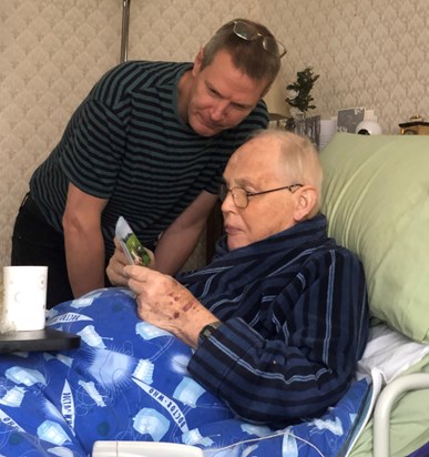 John and Bruce reading birthday cards, November 2022. 