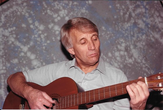 Ron playing the guitar.  When playing the guitar he sang in an odd sort of American accent which made me laugh.