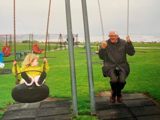 Catherine and Tom on the swings x