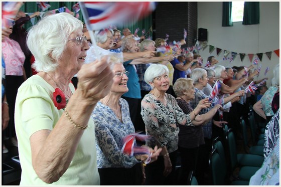 Dot enjoying herself with U3A Choir members at a concert to commemorate those who fought in WW1