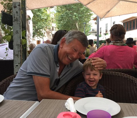 James and Dad sharing a joke on holiday.