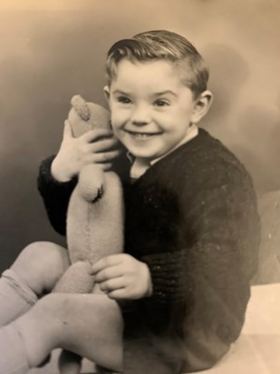 Rob as a young boy, showing off his cheeky smile 