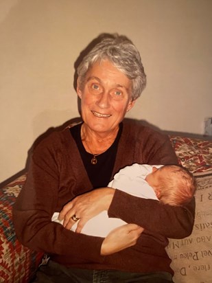 Mum holding her first granddaughter 2006