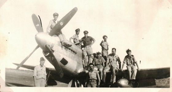 Dad (standing with black hair) and other 213 Squadron crews with a Mustang.