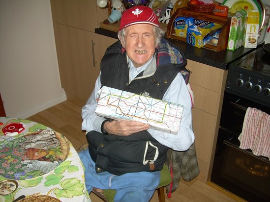 Dad's birthday 2015.  Tube map paper.  Wearing his favourite trousers.