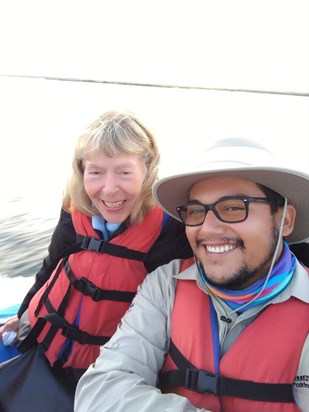 That smile! In the Galapagos Islands on a dinghy with our Park ranger guide. June 2022.