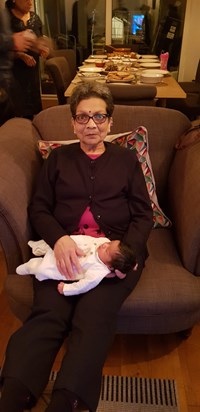 Mum holding baby Keira Varsha Patel at Indian Naming Ceremony
