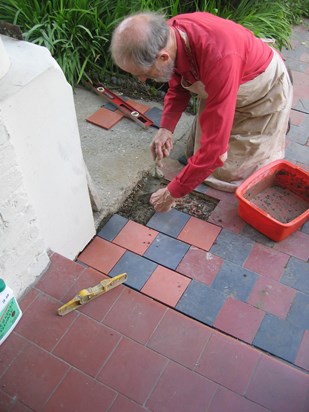 Peter repairing tiling for Russell and Richard.