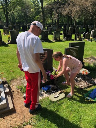 Tending Dad's grave with Isla