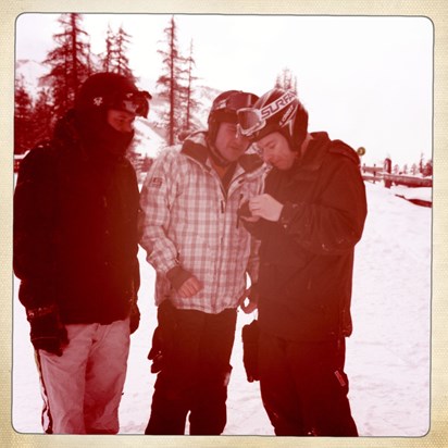 Craig, Martin & Paul trying to figure out a gadget. Another one from our snowboarding trip.