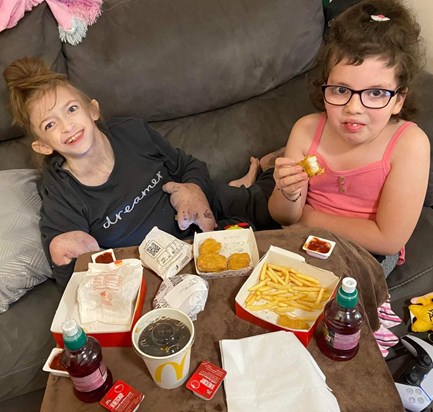 Hope and Nerissa enjoying their Happy Meal. 