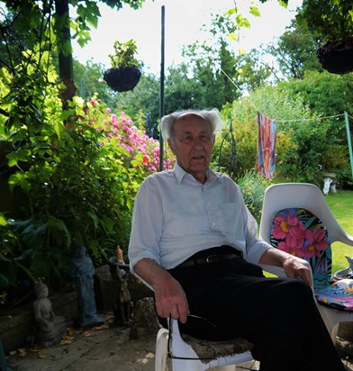 Dad under his grapevine in Stag Lane garden, a place he loved very much