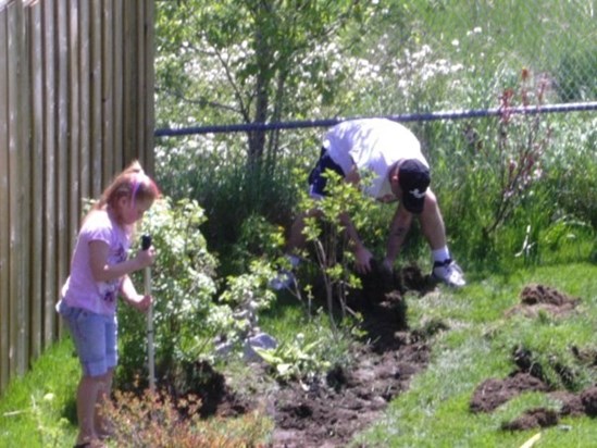 Jimmy & Brianna doing some gardening at his Sister Tina's house in Barrie.  Spring/Summer 2004.
