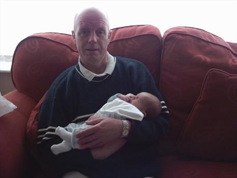 Meeting his Grandson Lewis for the first time