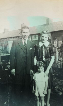 Graham with his parents George and Rose at their house in Dagenham