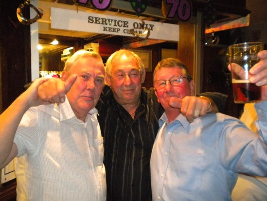 Enjoying a pint with his mates Bill and Rodney
