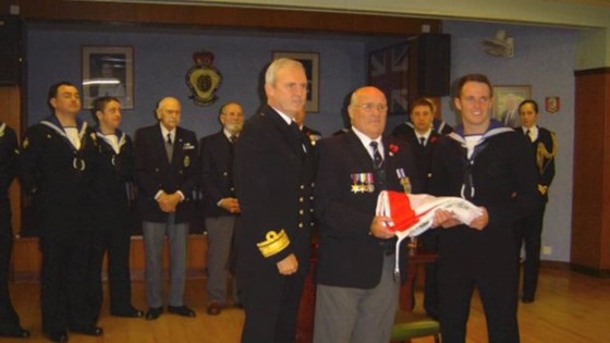 Receiving the Royal Oak ensign