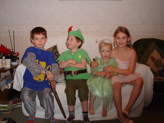 Four cousins playing dress up