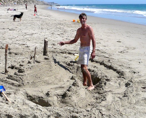 Jamie and his sand castle at Leo Carrillo beach